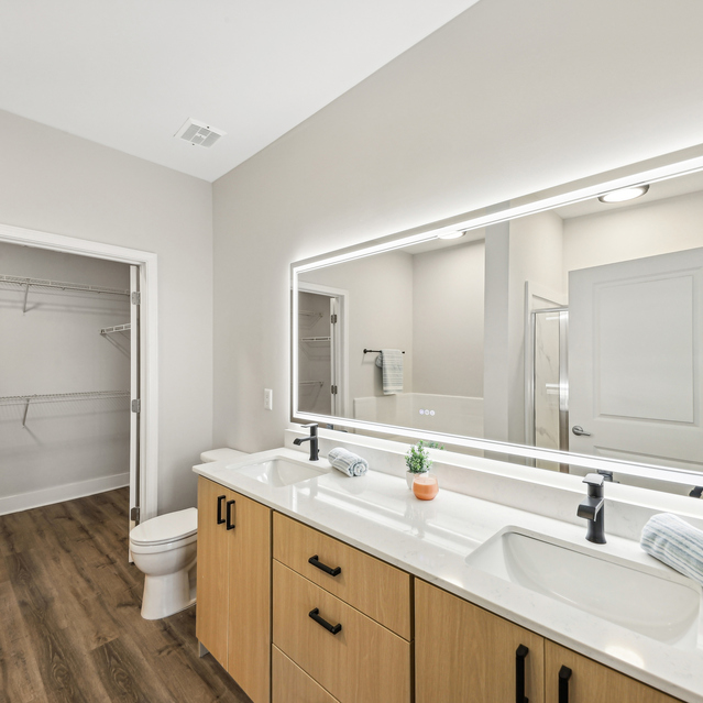 Drift Dunwoody - Renovated Apartments in Dunwoody, GA - Bathroom and Walk-in Closet