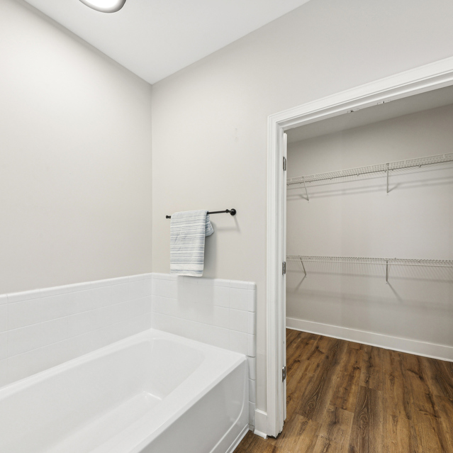 Drift Dunwoody - Renovated Apartments in Dunwoody, GA - Bathroom and Walk-in Closet